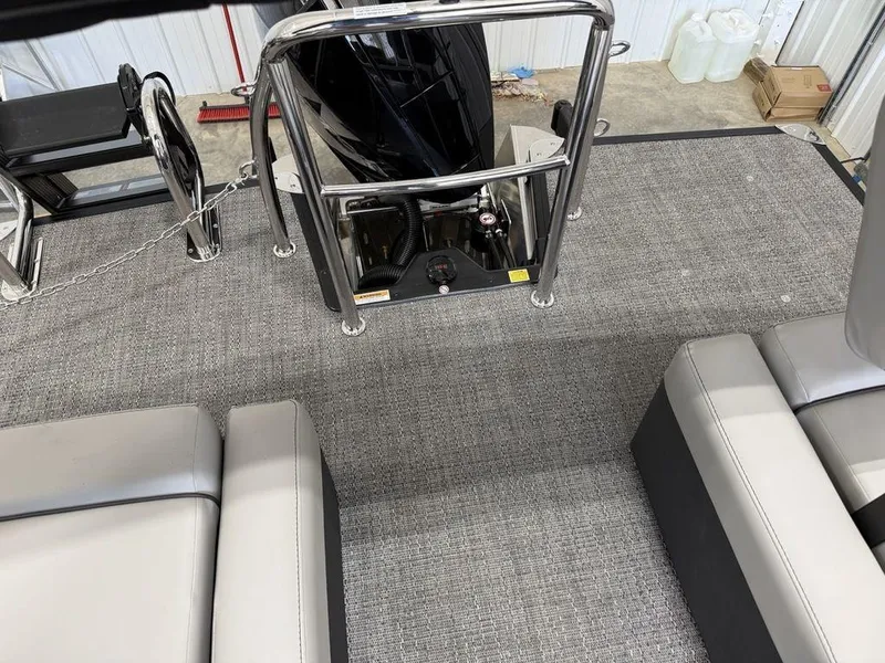 Slide: The Image of 2025 Barletta C22M boat interior with gray carpet and seating. - 22