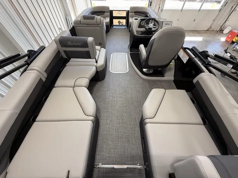 Slide: The Image of 2025 Barletta C22M pontoon boat interior with spacious seating and modern design. - 23