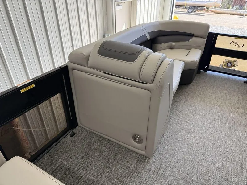 Slide: The Image of 2025 Barletta C22M pontoon boat interior with plush seating and modern design. - 9