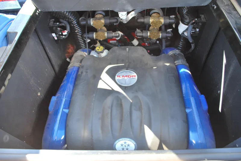 Slide: The Image of 2022 MasterCraft XStar engine compartment with Ilmor engine components. - 14