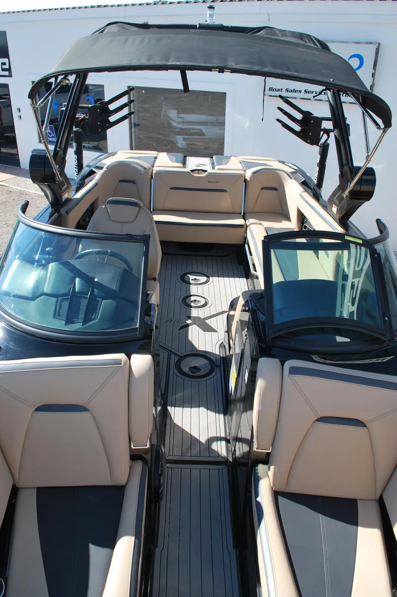 Slide: The Image of 2022 MasterCraft XStar boat with sleek interior and modern design. - 4