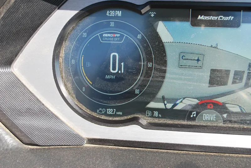Slide: The Image of 2022 MasterCraft XStar dashboard display showing speedometer and navigation screen. - 6