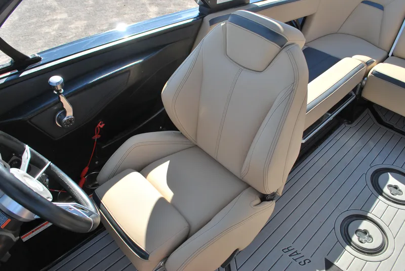 Slide: The Image of 2022 MasterCraft XStar interior with beige seating and sleek design. - 8