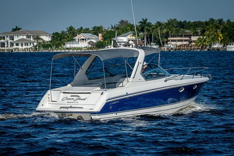Slide: The Image of 2003 Formula 330 SS Super Sport boat cruising on a sunny day. - 11