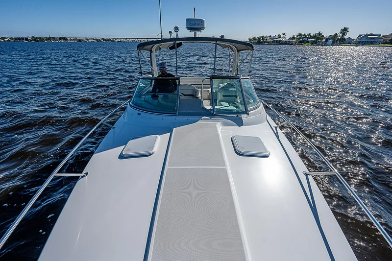 Slide: The Image of 2003 Formula 330 SS Super Sport boat cruising on open water. - 14