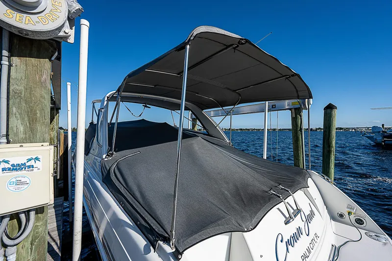 Slide: The Image of 2003 Formula 330 SS Super Sport boat docked with cover and canopy. - 20