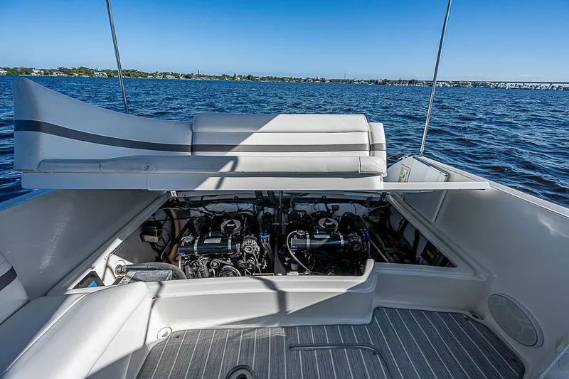 Slide: The Image of 2003 Formula 330 SS Super Sport boat engine compartment on open water. - 26