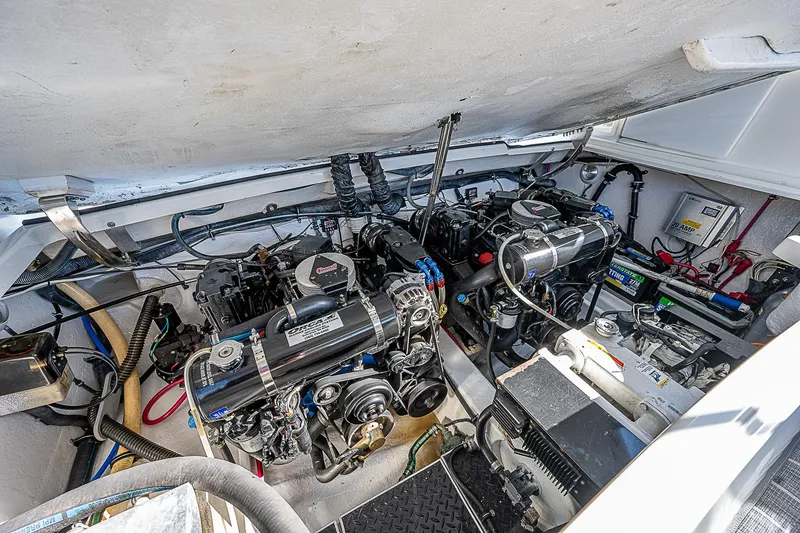 Slide: The Image of Engine compartment of 2003 Formula 330 SS Super Sport boat, showcasing dual engines. - 27