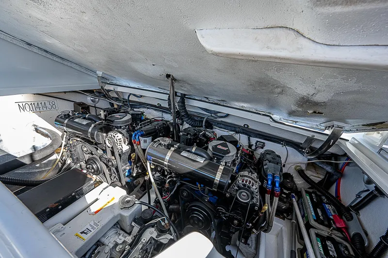 Slide: The Image of Engine compartment of 2003 Formula 330 SS Super Sport boat, showcasing dual engines. - 28