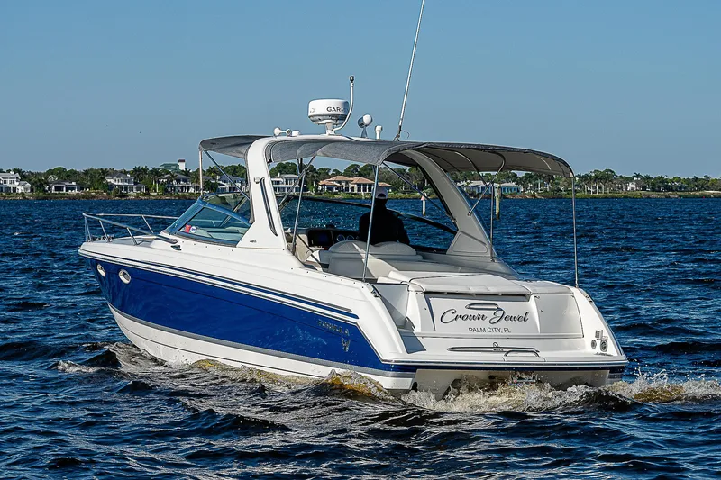 Slide: The Image of 2003 Formula 330 SS Super Sport boat cruising on a sunny day. - 3