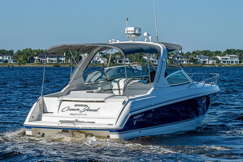 Slide: The Image of 2003 Formula 330 SS Super Sport boat cruising on a sunny day. - 4