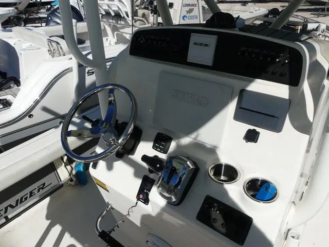 Slide: The Image of 2021 Avenger Boats AV24 helm with steering wheel and control panel. - 10