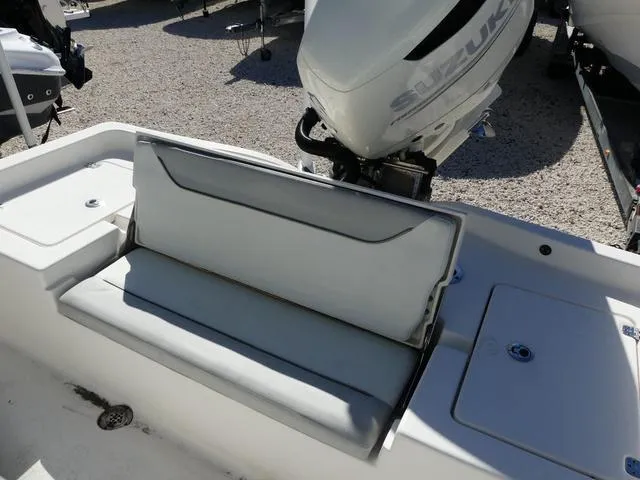 Slide: The Image of 2021 Avenger Boats AV24 with Suzuki outboard motor and cushioned seating. - 17