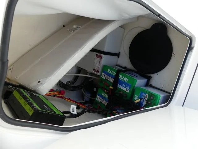 Slide: The Image of Avenger Boats AV24 2021 battery compartment with wiring and components. - 21