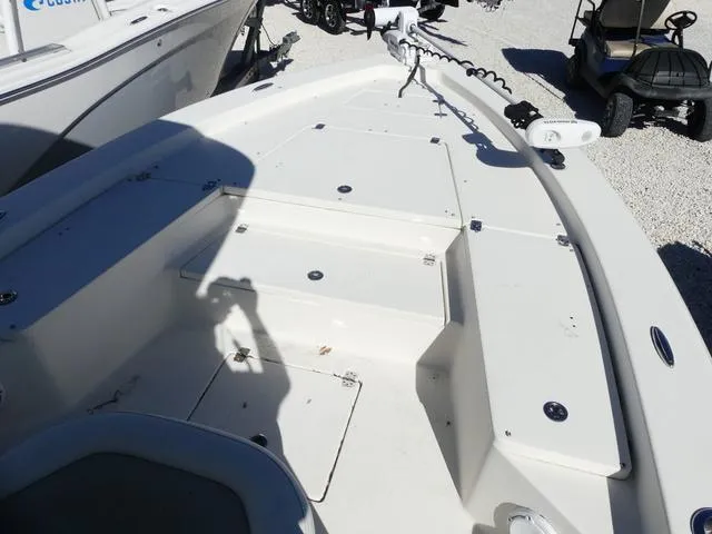 Slide: The Image of 2021 Avenger Boats AV24 deck with storage compartments and trolling motor. - 23