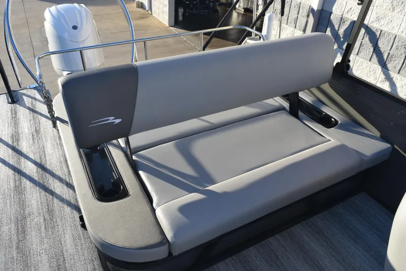 Slide: The Image of 2025 Bennington 23 SSBSE boat seating with sleek gray upholstery and modern design. - 11