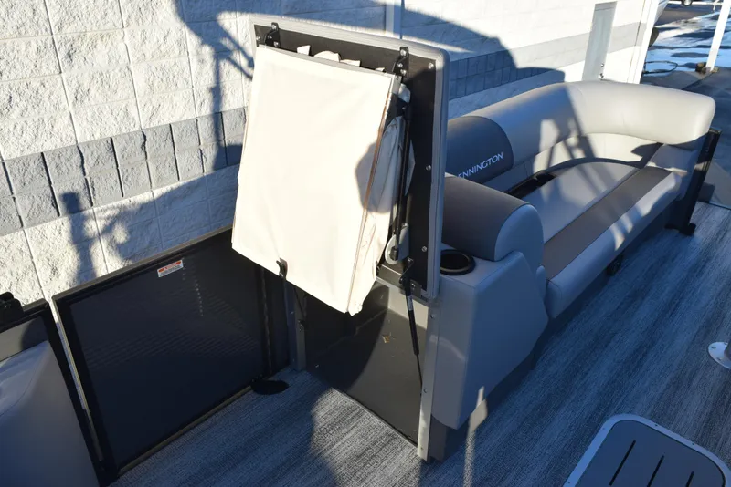 Slide: The Image of 2025 Bennington 23 SSBSE pontoon boat interior with seating and storage features. - 13
