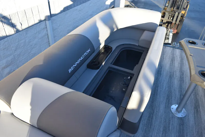 Slide: The Image of 2025 Bennington 23 SSBSE boat interior with spacious seating and storage compartment. - 14