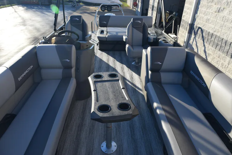 Slide: The Image of 2025 Bennington 23 SSBSE pontoon boat interior with plush seating and cup holders. - 6