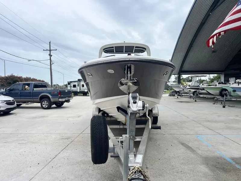 Slide: The Image of 2008 Sea Ray 270 SLX boat on trailer in marina setting. - 2