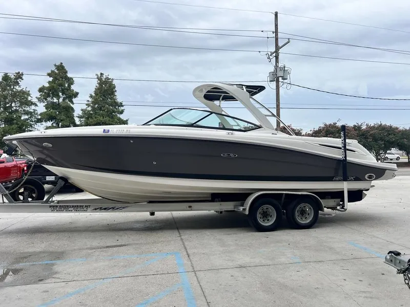 Slide: The Image of 2008 Sea Ray 270 SLX boat on trailer, parked outdoors. - 3