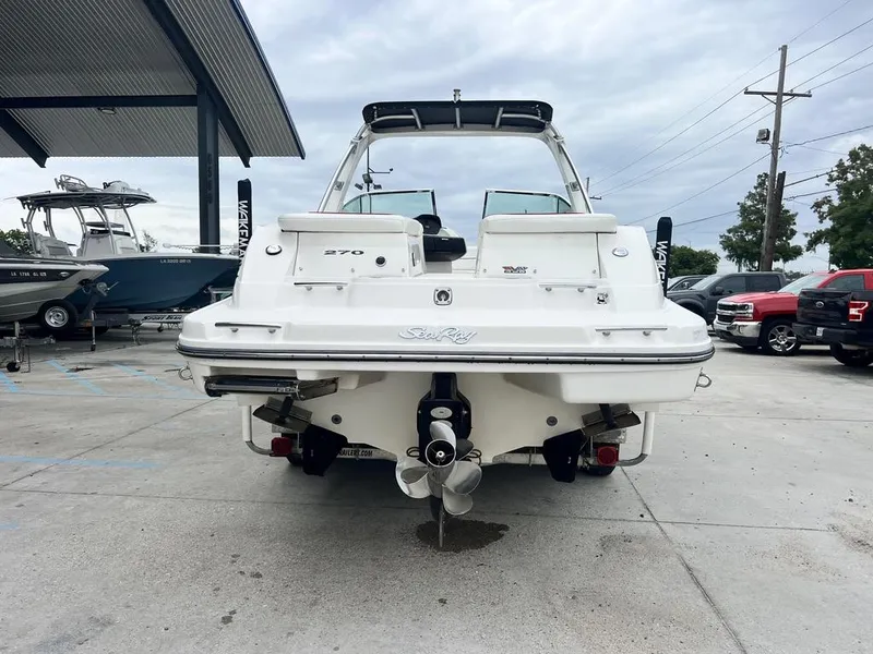 Slide: The Image of 2008 Sea Ray 270 SLX boat, rear view, parked outdoors on concrete. - 5