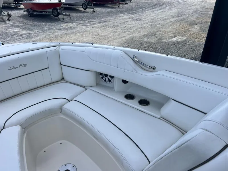 Slide: The Image of 2008 Sea Ray 270 SLX boat interior with white leather seating and cup holders. - 8
