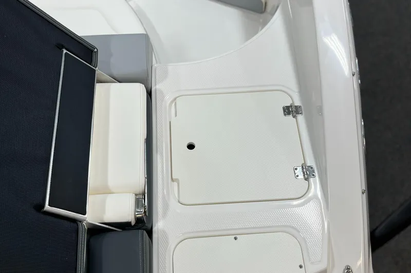 Slide: The Image of 2025 Chaparral 23 SSi boat deck with storage compartments and seating area. - 4