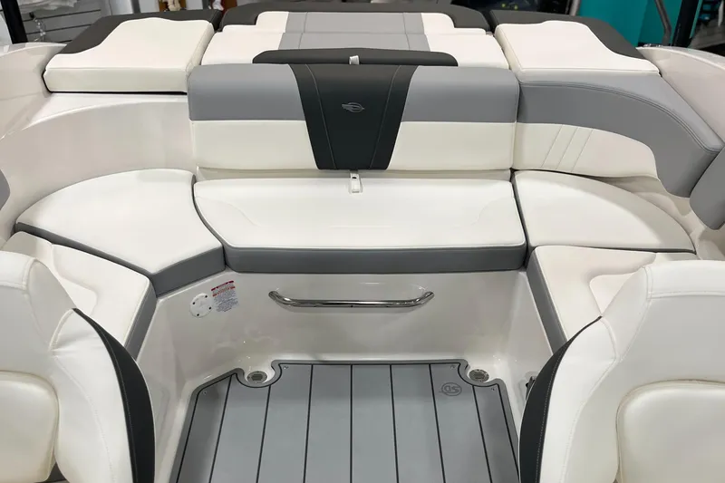 Slide: The Image of 2025 Chaparral 23 SSi boat interior with white and gray seating arrangement. - 6