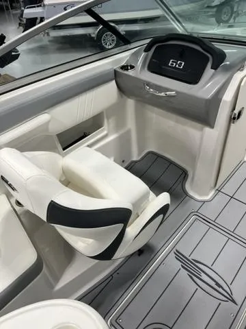 Slide: The Image of 2025 Chaparral 23 SSi boat interior with modern dashboard and seating. - 9