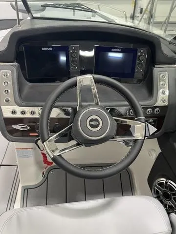 Slide: The Image of 2025 Chaparral 30 Surf boat interior with sleek gray and white seating. - 10