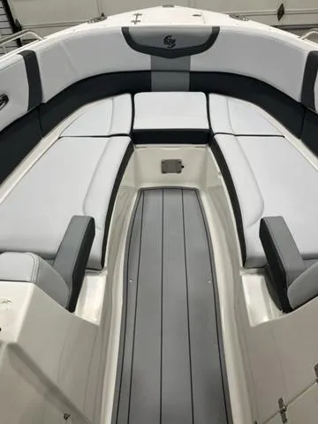 Slide: The Image of 2025 Chaparral 30 Surf boat interior with compact bathroom and sink. - 12