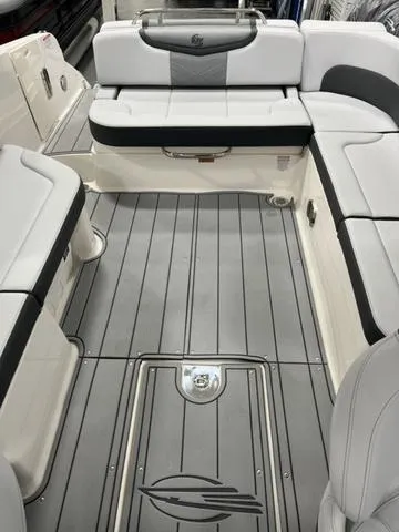 Slide: The Image of 2025 Chaparral 30 Surf boat interior with sleek gray seating and flooring. - 15