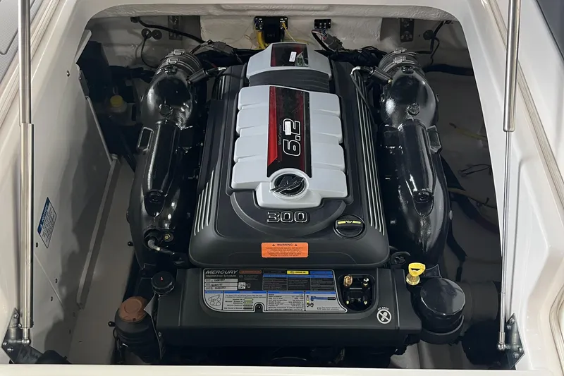 Slide: The Image of 2025 Chaparral 247 SSX boat dashboard with dual Simrad displays and Gussi Italia steering wheel. - 10