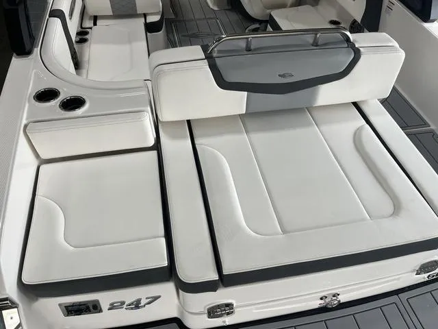 Slide: The Image of 2025 Chaparral 247 SSX boat displayed indoors, featuring sleek design and modern features. - 2