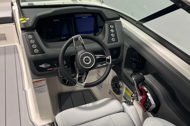 Slide: The Image of 2025 Chaparral 247 SSX boat cockpit with modern steering and control panel. - 5