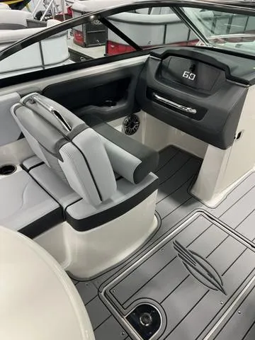 Slide: The Image of 2025 Chaparral 247 SSX boat interior with sleek seating and modern dashboard design. - 8