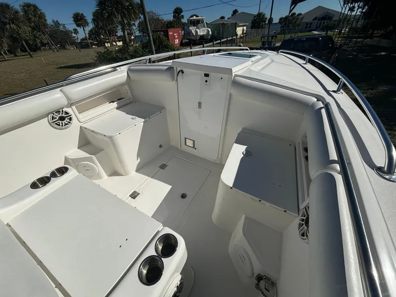 Slide: The Image of 2002 Marlago 35 FS boat interior with seating and storage compartments. - 21