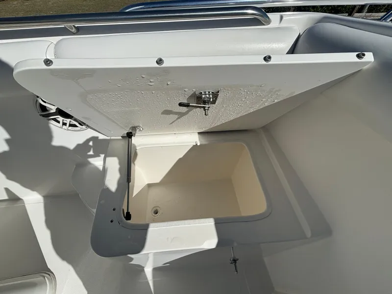 Slide: The Image of Open storage compartment on 2002 Marlago 35 FS boat. - 23