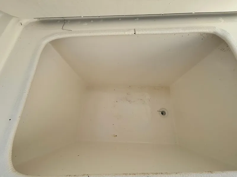 Slide: The Image of Empty storage compartment in 2002 Marlago 35 FS boat. - 26