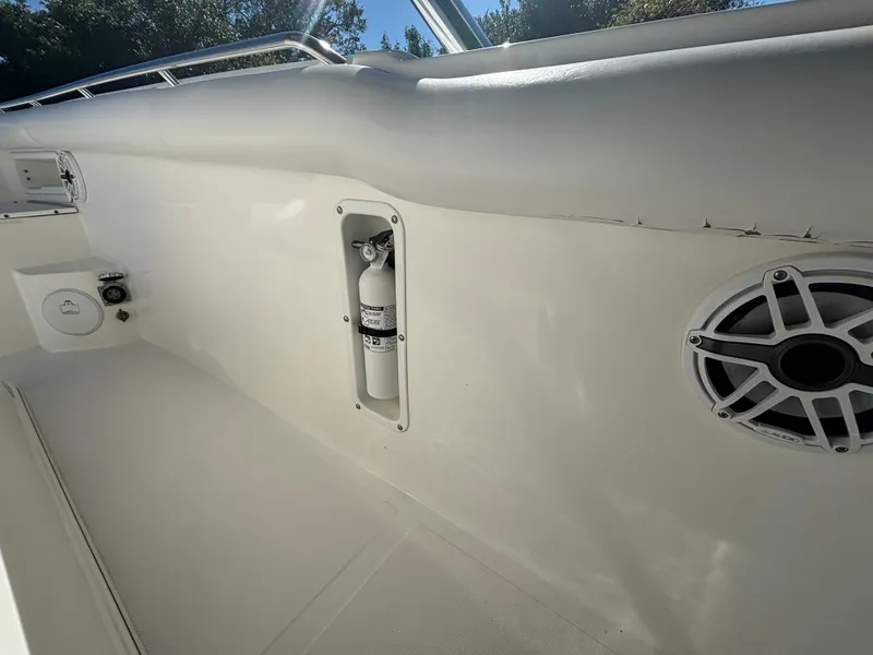 Slide: The Image of 2002 Marlago 35 FS boat interior with fire extinguisher and speaker. - 27