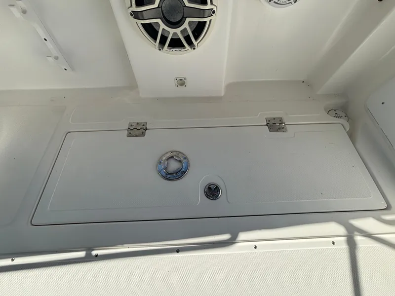 Slide: The Image of 2002 Marlago 35 FS boat deck with speaker and hatch. - 32