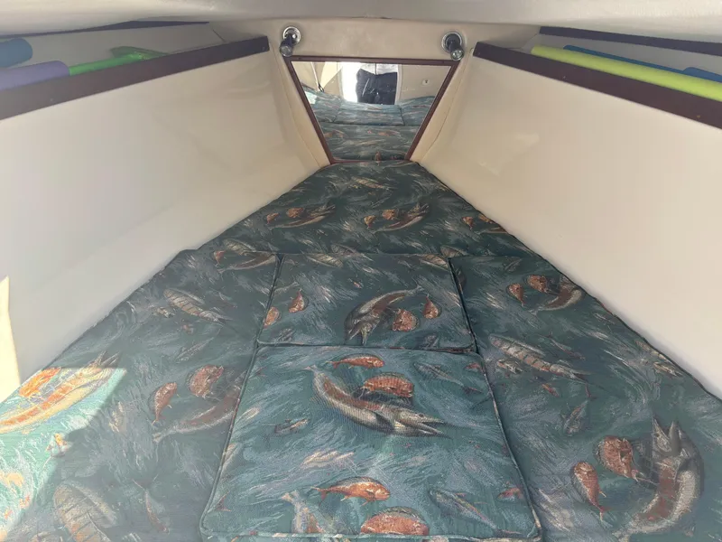 Slide: The Image of Interior cabin of 2002 Marlago 35 FS boat with fish-patterned upholstery. - 41