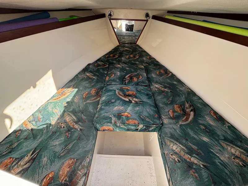 Slide: The Image of 2002 Marlago 35 FS boat cabin with fish-patterned upholstery. - 42