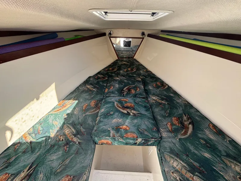 Slide: The Image of Interior cabin of 2002 Marlago 35 FS boat with fish-patterned cushions. - 43