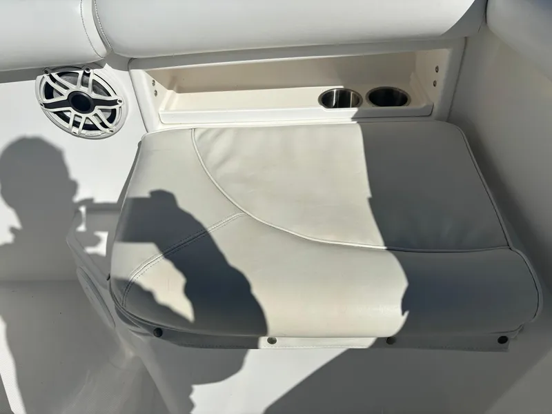 Slide: The Image of Marlago 35 FS 2002 boat seat with cup holders and speaker. - 45