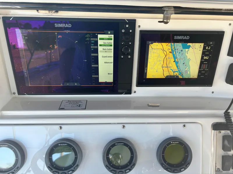Slide: The Image of Simrad navigation displays on 2002 Marlago 35 FS boat dashboard. - 49