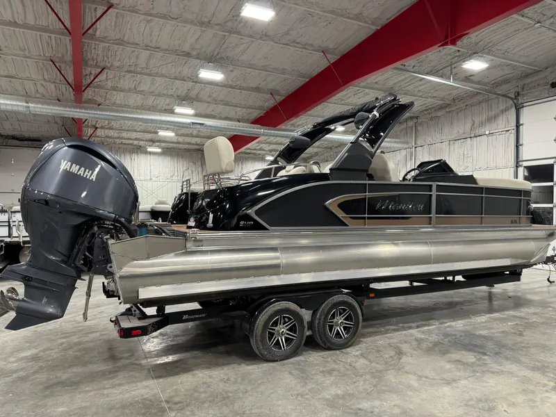 Slide: The Image of 2023 Manitou 25 LX Twin SHP pontoon boat with Yamaha engine in showroom. - 3