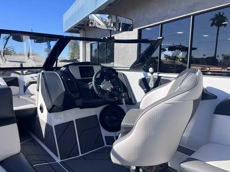 Slide: The Image of Interior of 2025 Supreme S240 boat with modern dashboard and seating. - 6