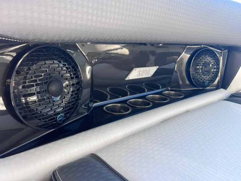 Slide: The Image of Supreme S240 2025 interior with speakers and cup holders. - 8